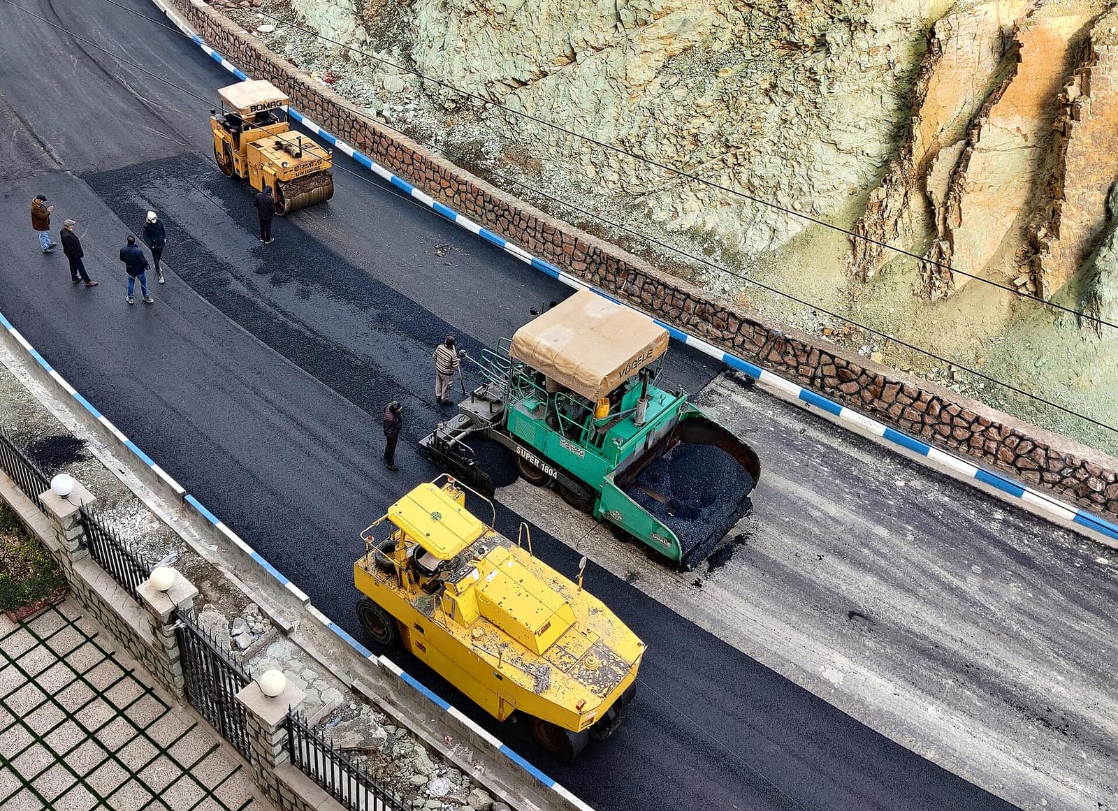 Paving machines laying asphalt on a road